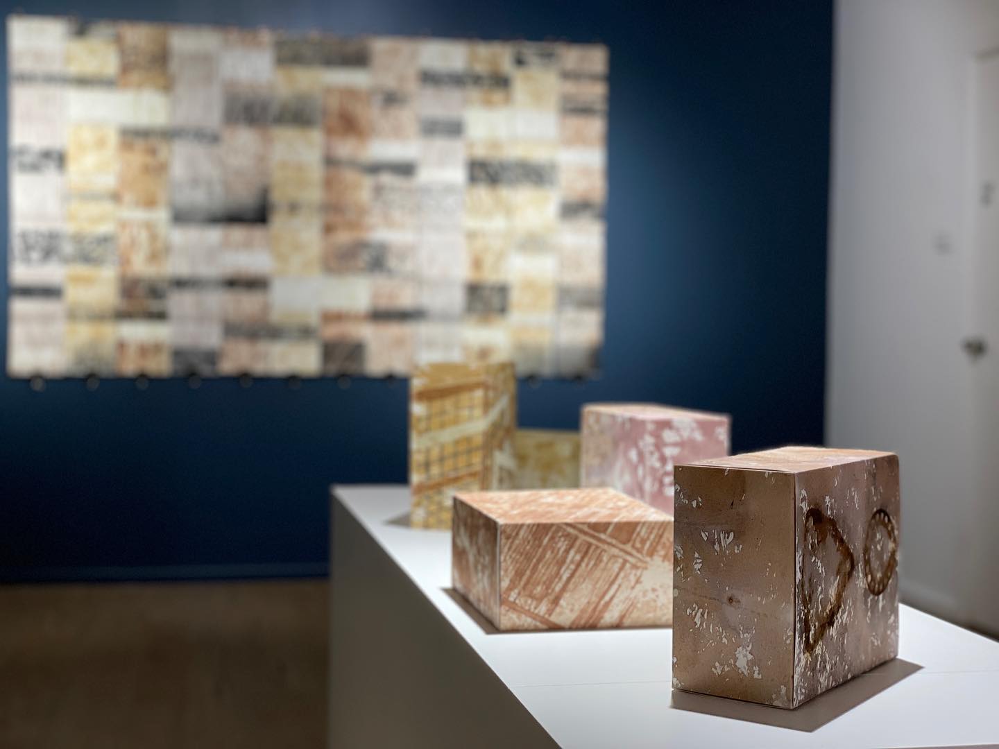 art installation, comprising stone coloured rectangular boxes,